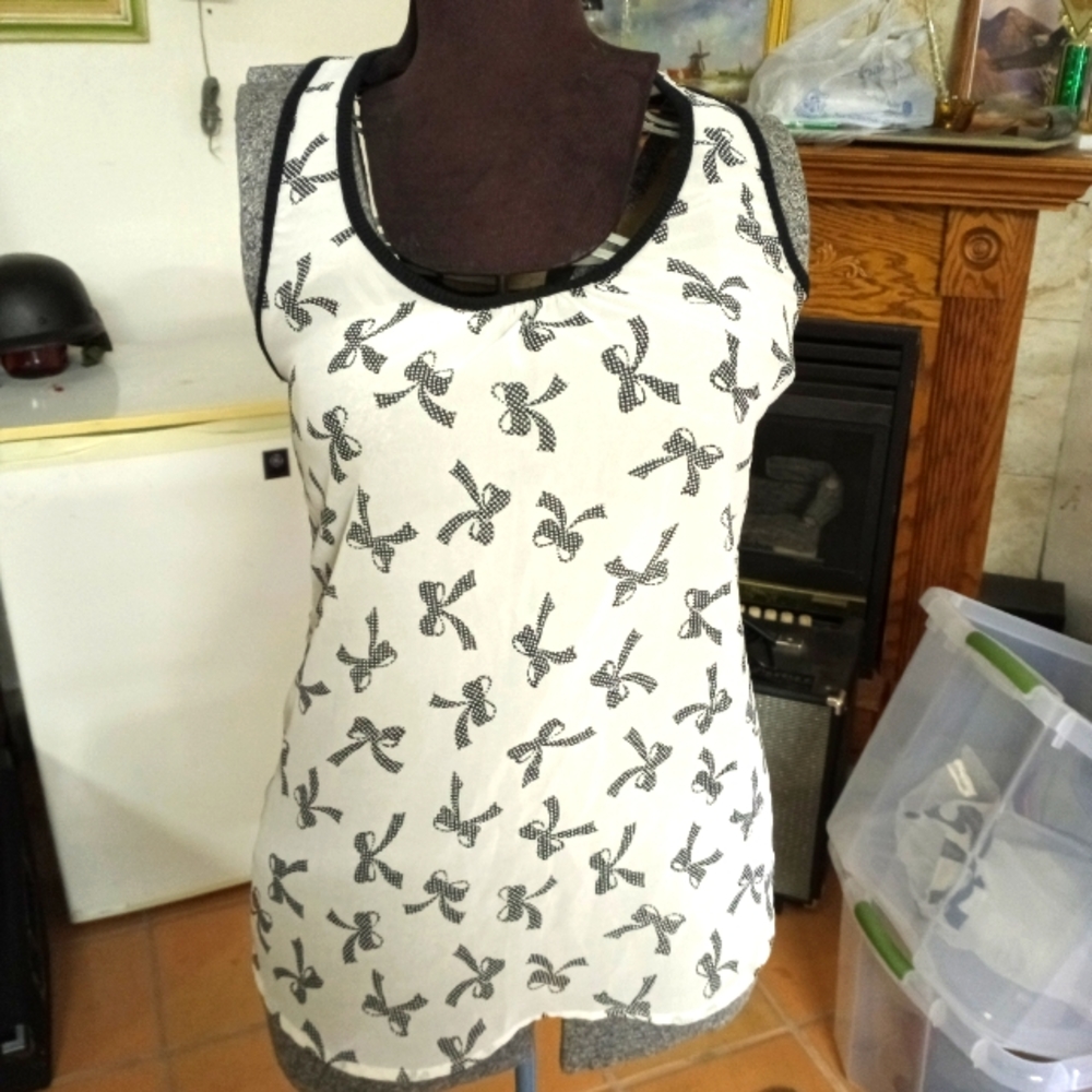 Sheer blouse with bow eccentrics